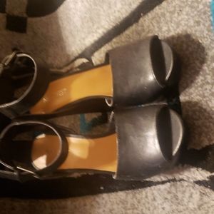 Nine West black leather platform shoe.